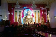 13-3 A Large 5m Tall Buddha Sits Atop A Giant Lotus flower With An Ethereal Blue Halo Around Its Head In Mahayana Buddhist Temple At 133 Canal St In Chinatown New York City.jpg